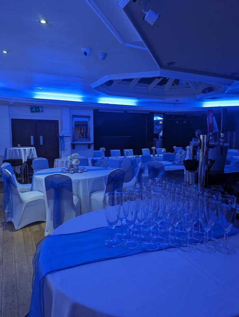 Reception with champagne and blue ambient lighting