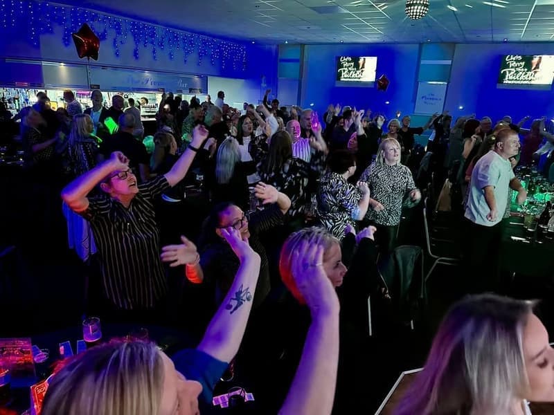 Guests celebrating together at a packed function